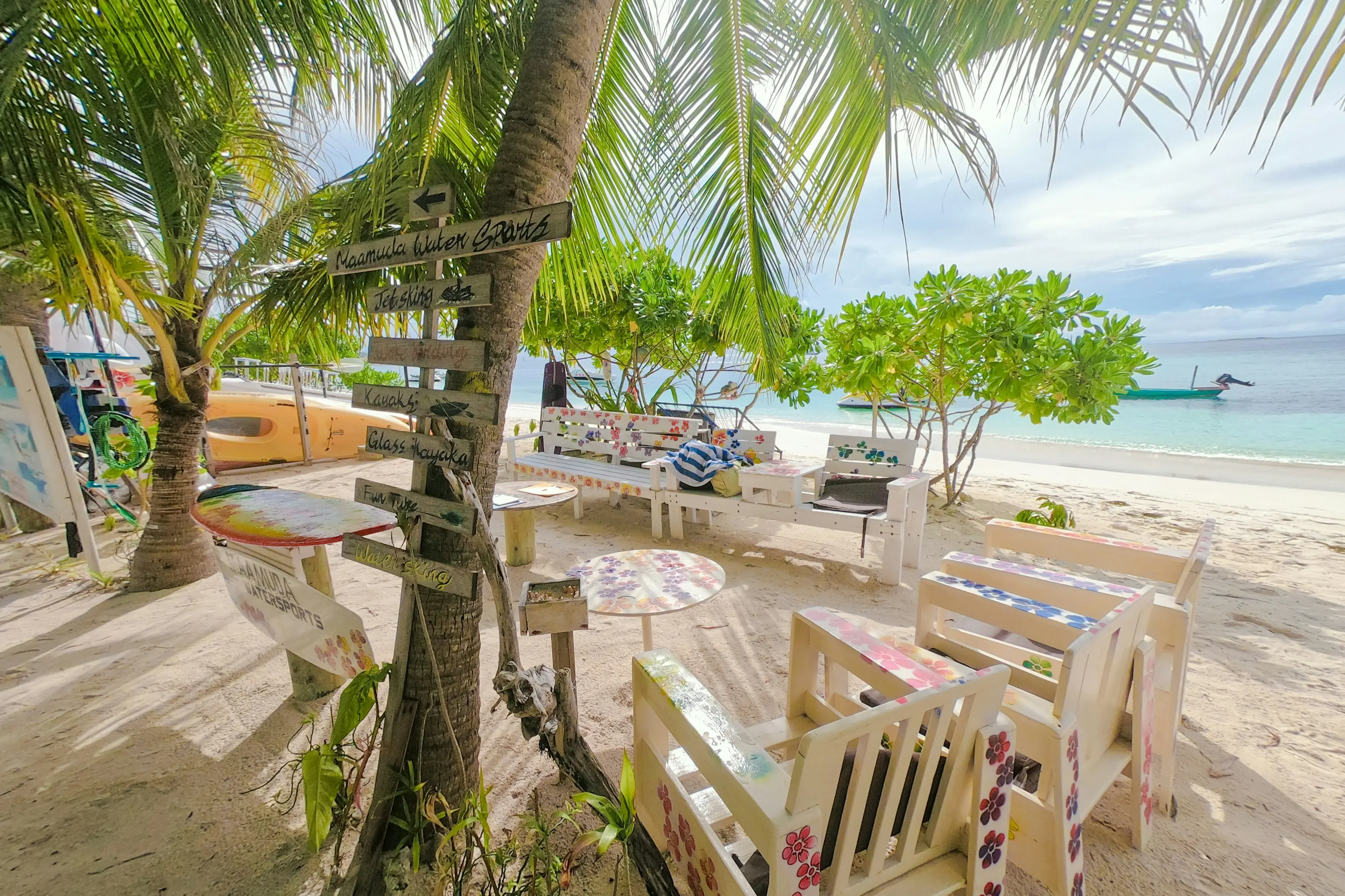 A beach cafe under the palms on Maafushi